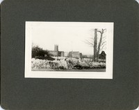 Gasson Hall, Saint Mary&#39;s Hall, and Devlin tower from road behind fence by Clifton Church