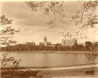 Devlin Hall, Gasson Hall, and Saint Mary&#39;s Hall from reservoir, with path and bench, by Clifton Church
