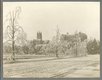 Gasson Hall and Saint Mary&#39;s Hall from snowy path around reservoir, by Clifton Church
