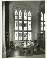 Bapst Library interior: Gargan Hall alcoves with students studying at desks and views of stained glass windows