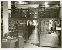 Bapst Library interior: stacks with John O&#39;Loughlin at his desk