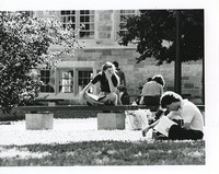 Fulton Hall exterior: students on benches