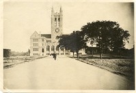 Gasson Hall exterior: front from Linden Lane with man and child walking in street