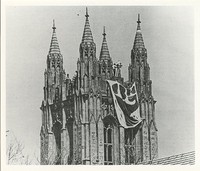 Gasson Hall exterior: bell tower with flag during strike