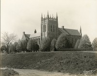 Bapst Library exterior: Ford Tower and dirt roads by Clifton Church