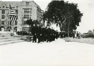Bapst Library exterior: dedication with Jesuits
