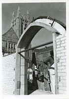 Lyons Hall exterior: arch during construction with Gasson tower in background