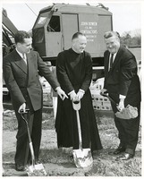 McHugh Forum exterior: groundbreaking, Michael P. Walsh with a shovel