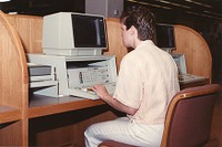 O&#39;Neill Library interior: student using computer with Infotrac