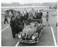 Roberts Center exterior: groundbreaking with Joseph R. N. Maxwell and Richard Cushing getting into Volkswagen Beetle