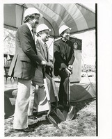 Robsham Theatre exterior: groundbreaking, J. Donald Monan and two unidentified men with shovels