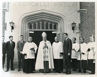 Roncalli Hall exterior: dedication with Francis B. McManus, Eric F. MacKenzie, and Michael P. Walsh on the front steps