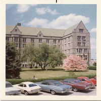 Saint Mary&#39;s Hall exterior: back and lawn with parked cars