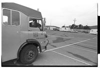 Travelers being evicted from car park by council officials while Royal Ulster Constabulary (RUC) officers stand by, Downpatrick