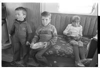 Traveler families in a layby and children eating in a caravan, outside Downpatrick, County Down