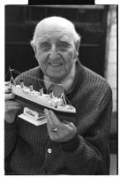 Samuel McLaughlin, riveter on the Titanic, with model of the Titanic