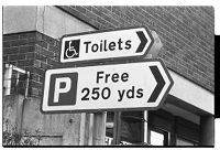 Humorous road sign (&quot;Toilets&quot; and &quot;Free 250 yds&quot;), Newcastle, County Down