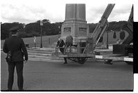 Ian Paisley climbing into the hydraulic lift before ascending next to statue of Sir Edward Carson, Stormont building, Belfast