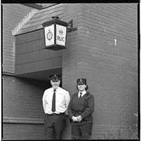 Officers under the old station lamp, Royal Ulster Constabulary (RUC) station, Banbridge, County Down,