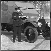 Lancia &quot;cage&quot; car from the 1920s, exhibit in the Royal Ulster Constabulary (RUC) Museum with officer in uniform of the time including contemporary weapon, Belfast