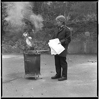 Officer burning confidential papers in bin, Royal Ulster Constabulary (RUC) station, Kircubbin, County Down