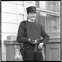 Female officer with gun, Royal Ulster Constabulary (RUC) station, Downpatrick, County Down