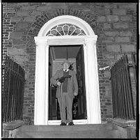 Paddy Brennan, traditional musician (fiddler), alone and with his wife, at home, English St.